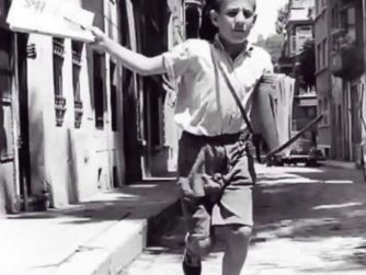 Newspaper selling boy 1958
