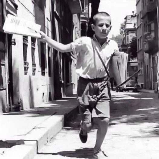 Newspaper selling boy 1958