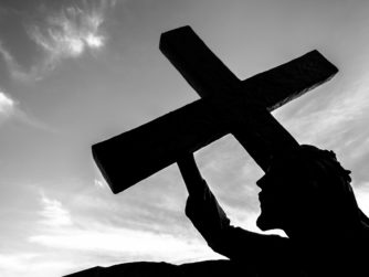 Bronze statue of jesus carrying his cross on the 2022 11 01 01 17 56 utc r